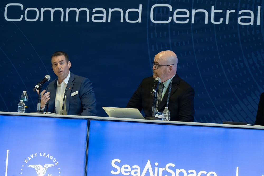 NAVSUP officials Dan Lenza and Michael Power present on a contracting panel at Sea-Air-Space 2026 in National Harbor, Maryland
