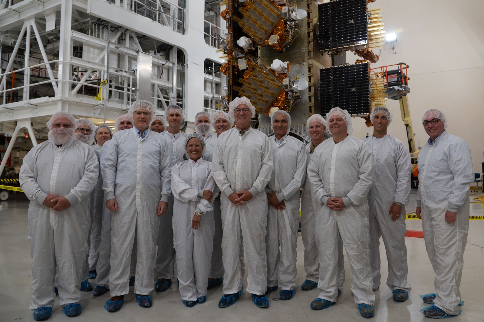 Secretary of the Air Force Troy Meink and Senator Kevin Cramer pose with Space Force leadership in front of Space Development Agency Tranche 1 satellites at Vandenberg Space Force Base