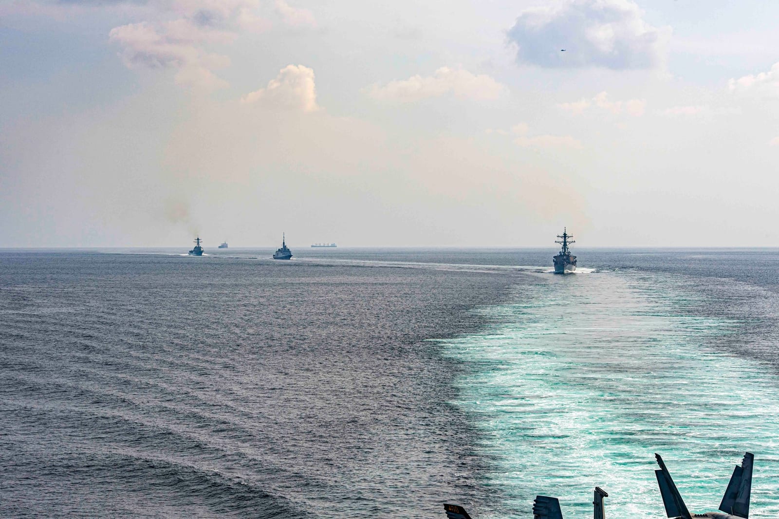 USS Stethem, French frigate FS Languedoc, and USS Gravely transit the Strait of Hormuz alongside the Eisenhower Carrier Strike Group