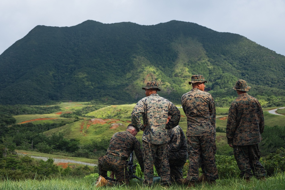 U.S. Marines firing an M240B machine gun during a live-fire range exercise