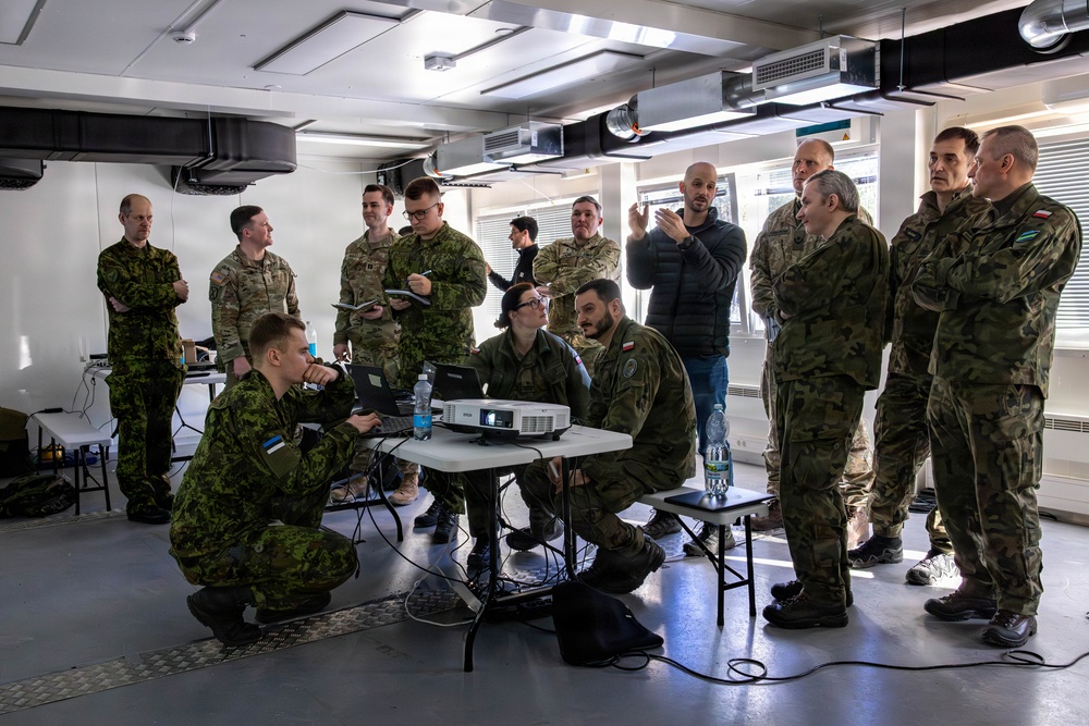 NATO allied forces observe civilian defense contractors demonstrate counter-drone software during a demonstration in Estonia