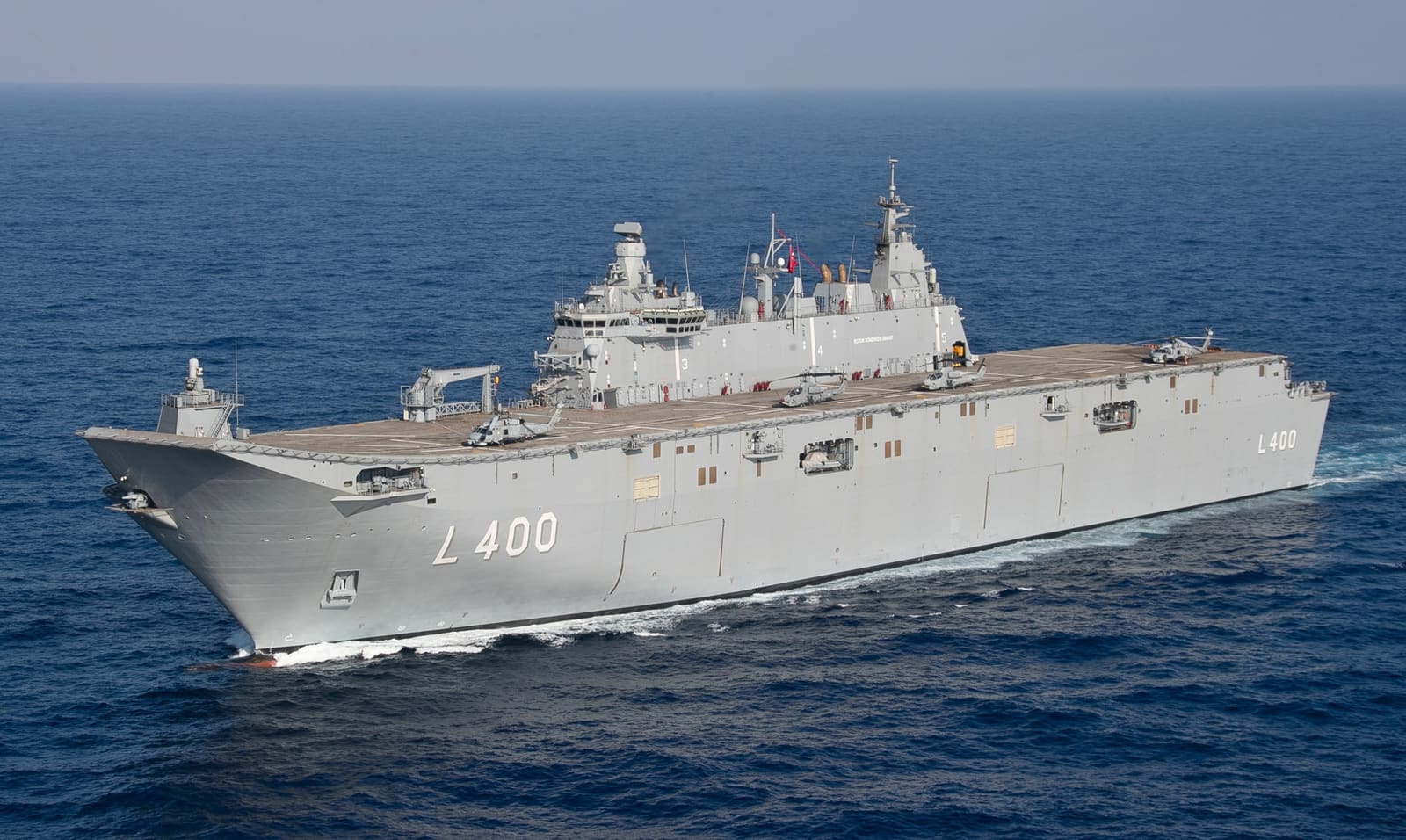 Turkish Navy amphibious assault ship TCG Anadolu (L-400) steaming in the Mediterranean Sea, the light carrier Baykar is developing Kizilelma to operate from