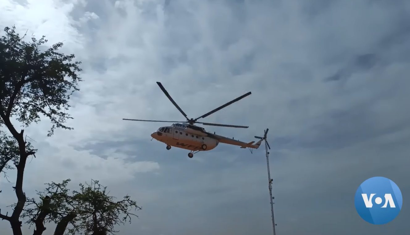 A World Food Programme helicopter on the ground in besieged Djibo, Burkina Faso, September 2022