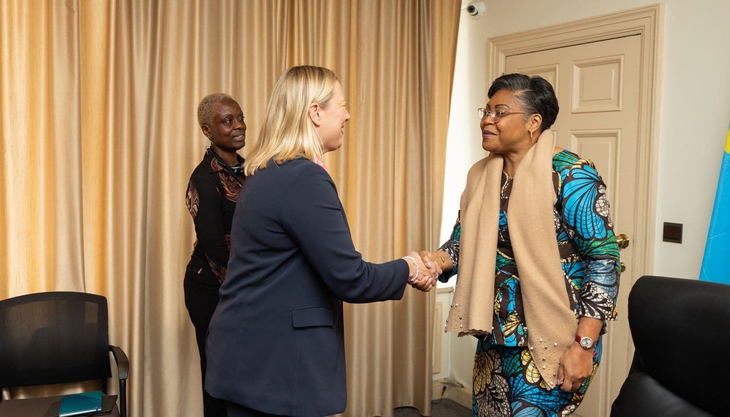 DRC Prime Minister Judith Suminwa Tuluka seated at a meeting table with European Commissioner Jutta Urpilainen