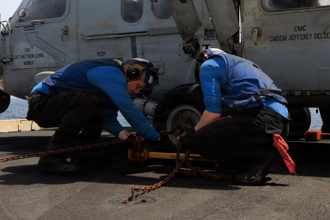 Sailors secure an MH-60S Sea Hawk helicopter, the same aircraft type involved in the July 1, 2026 crash, to an elevator aboard USS George H.W. Bush in the Arabian Sea