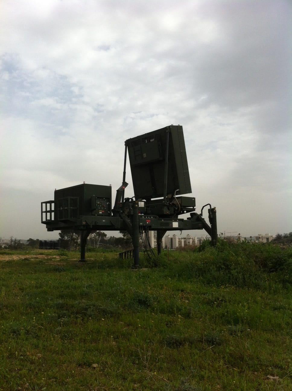 An Iron Dome air-defense battery firing an interceptor into the night sky