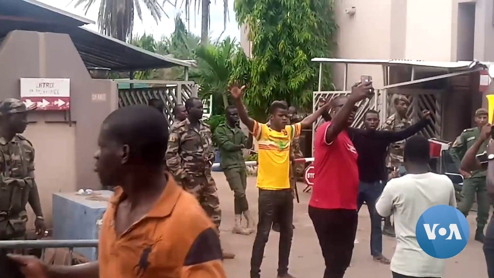 Malian soldiers and cheering civilians in the streets of Bamako during the August 2020 coup