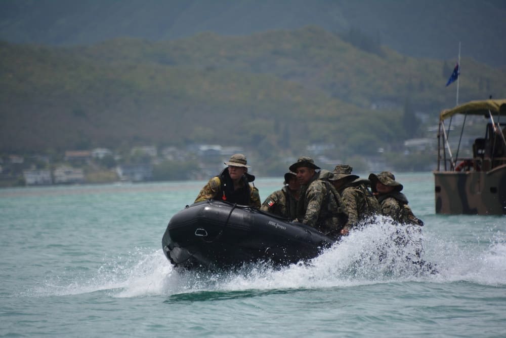 Mexican Naval Infantry Marines carrying a combat rubber raiding craft during an amphibious training exercise