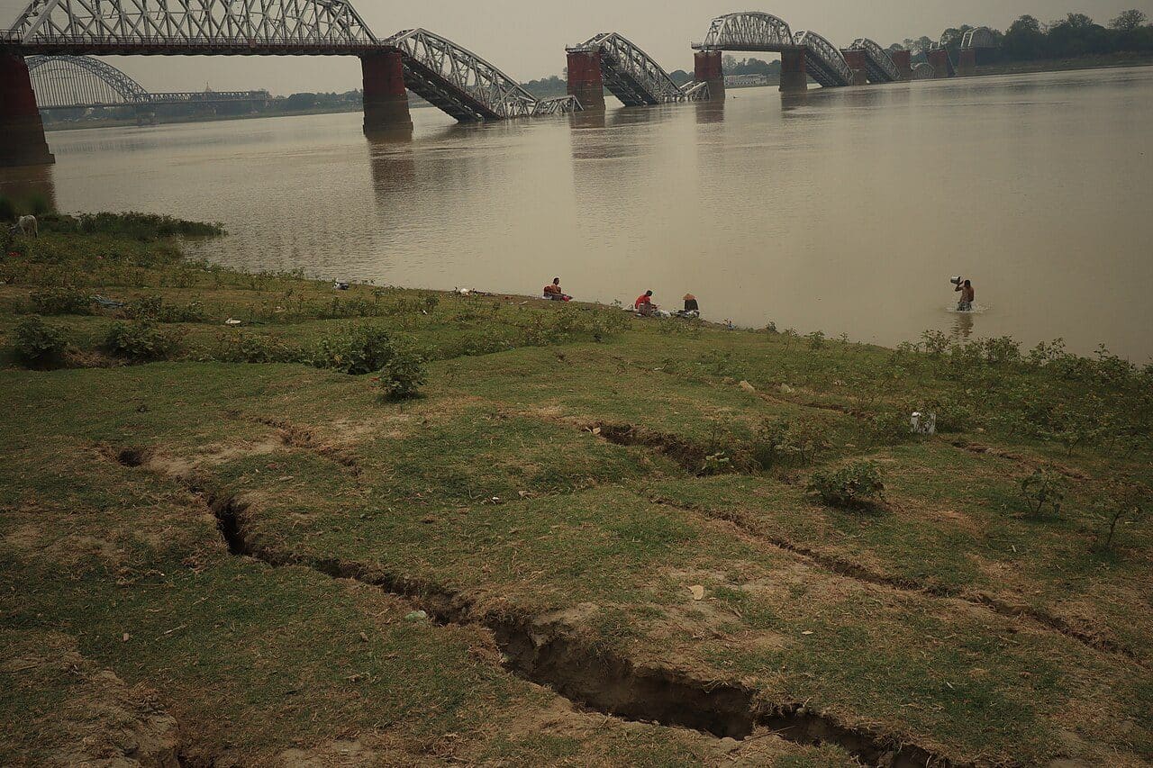 The collapsed Sagaing Bridge over the Irrawaddy River, with debris and a fallen span in the water below, after the March 2025 earthquake
