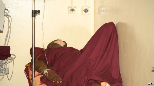 A bombing survivor rests in a hospital bed after the April 2014 Nyanya bus station bombing near Abuja