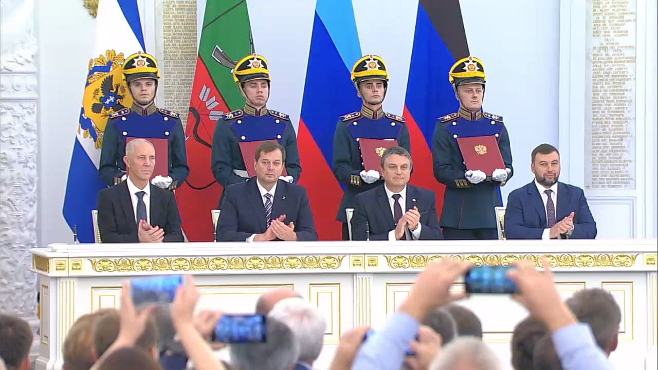 Russian-installed officials from Donetsk, Luhansk, Zaporizhzhia and Kherson applaud during the treaty-signing ceremony in the Kremlin's St George Hall on September 30, 2022
