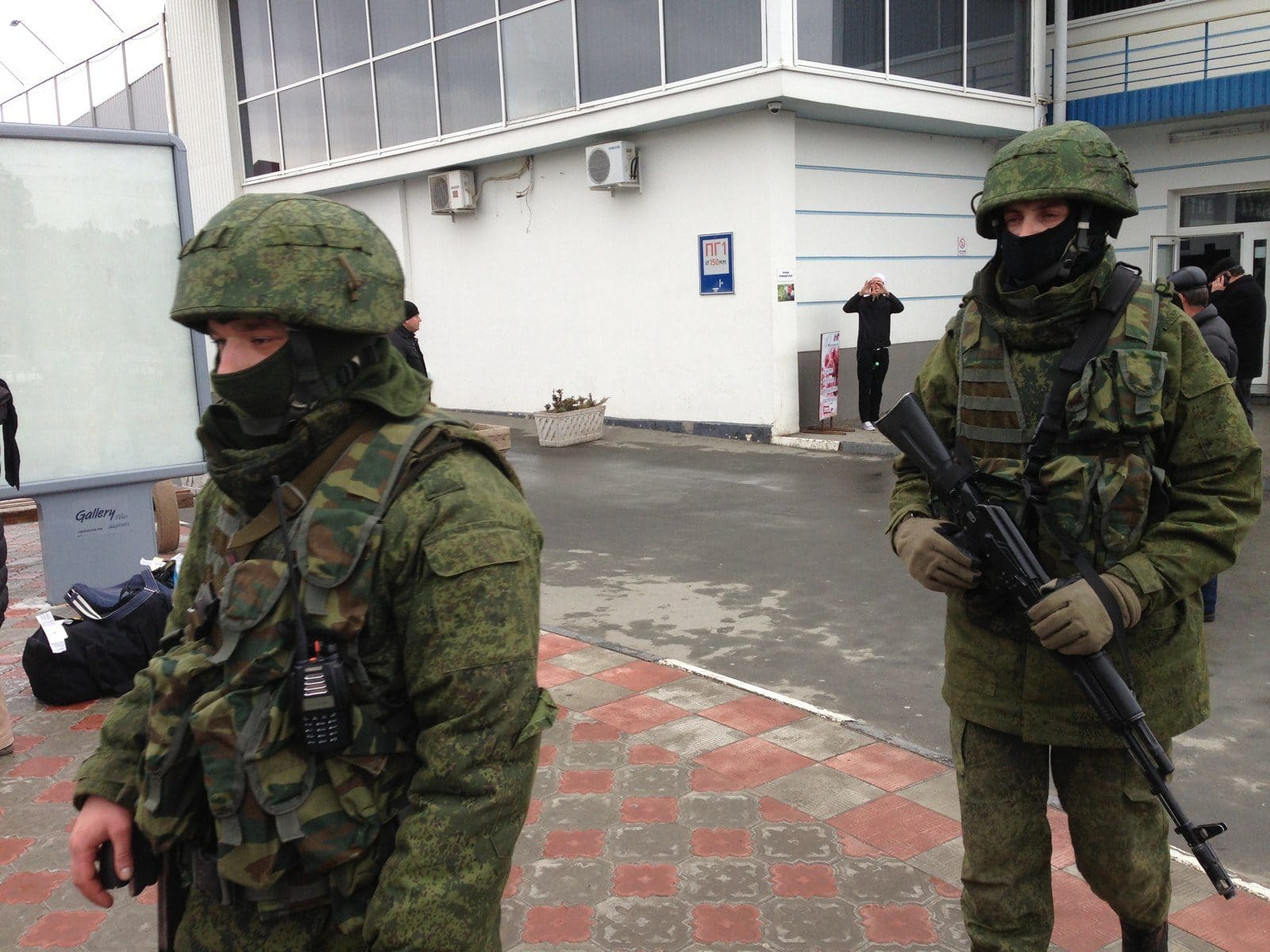 Unmarked armed personnel on patrol at Simferopol Airport in Crimea, February 28, 2014