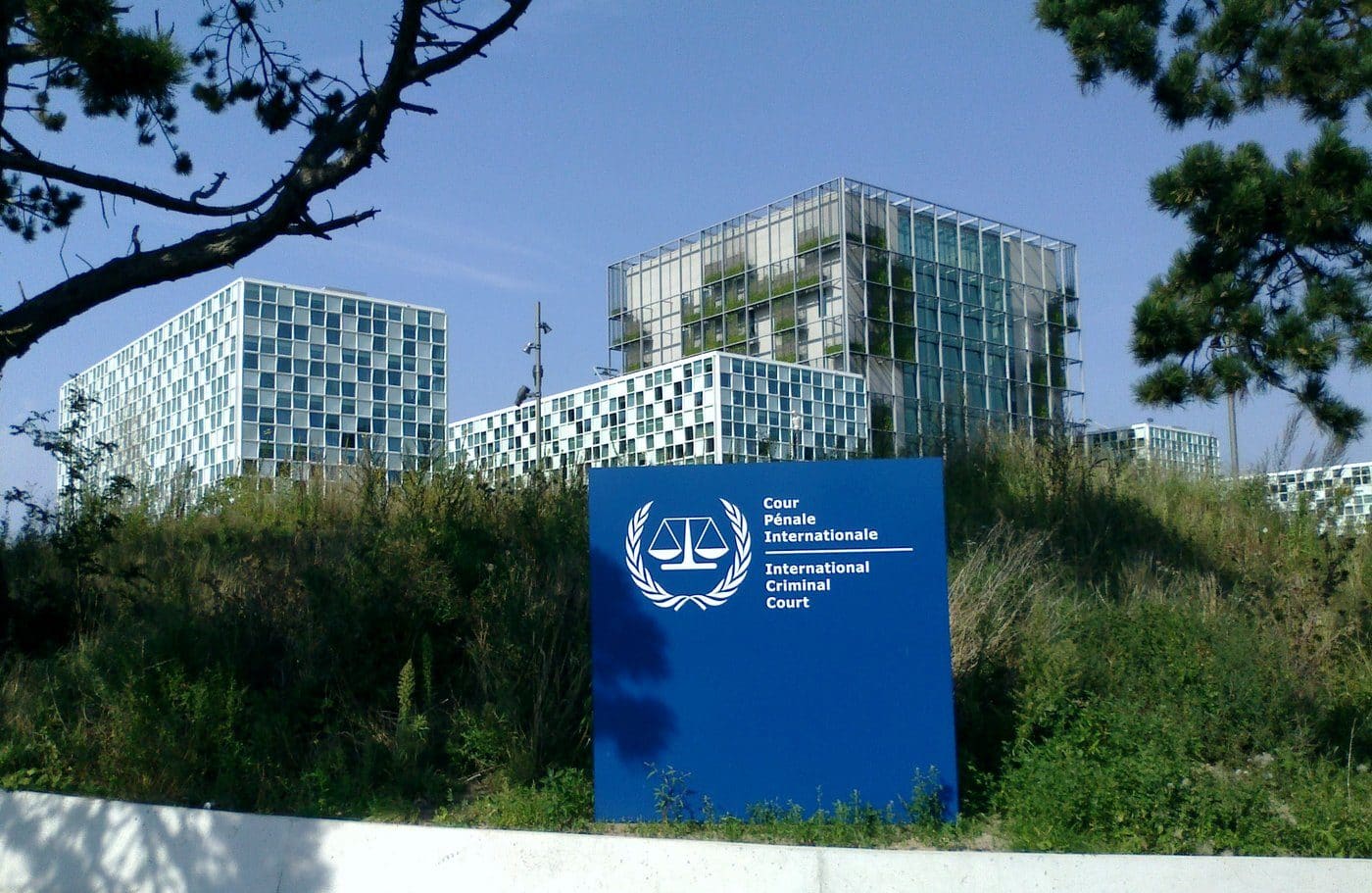 The International Criminal Court's permanent premises building in The Hague, with an ICC signboard in the foreground