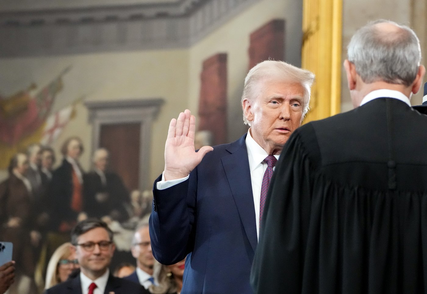 Donald Trump taking the oath of office from Chief Justice John Roberts at his second inauguration on January 20, 2025