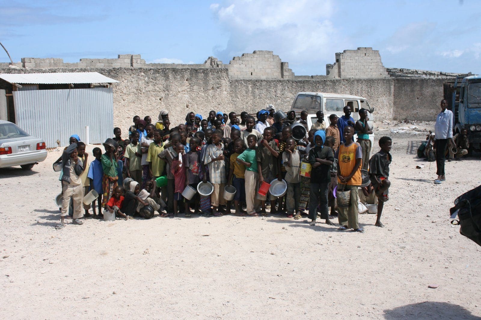 Children queue for food aid at a distribution centre in Mogadishu, Somalia, during the 2011 famine