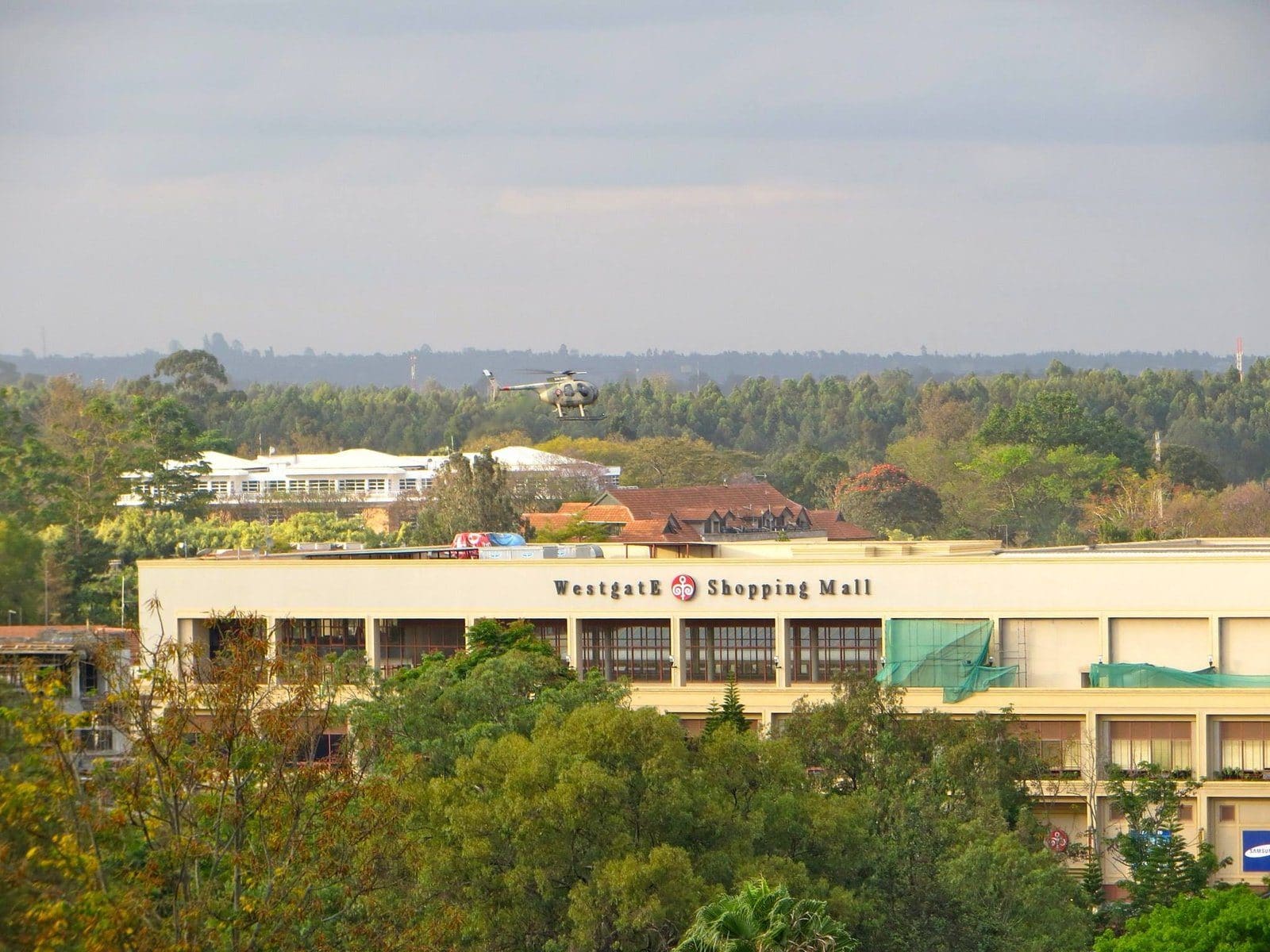 A military helicopter hovers over the Westgate shopping mall in Nairobi during the four-day siege