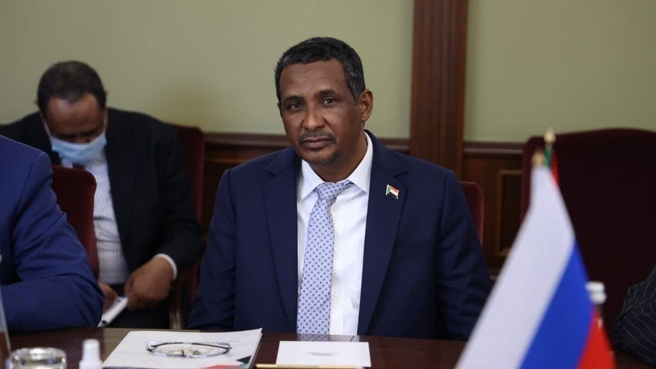 RSF commander Mohamed Hamdan "Hemedti" Dagalo seated at a conference table
