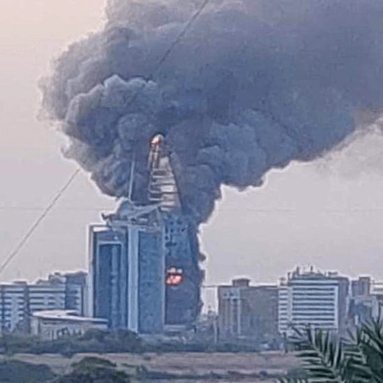 Smoke and fire rising from a building in Khartoum during the 2023 fighting