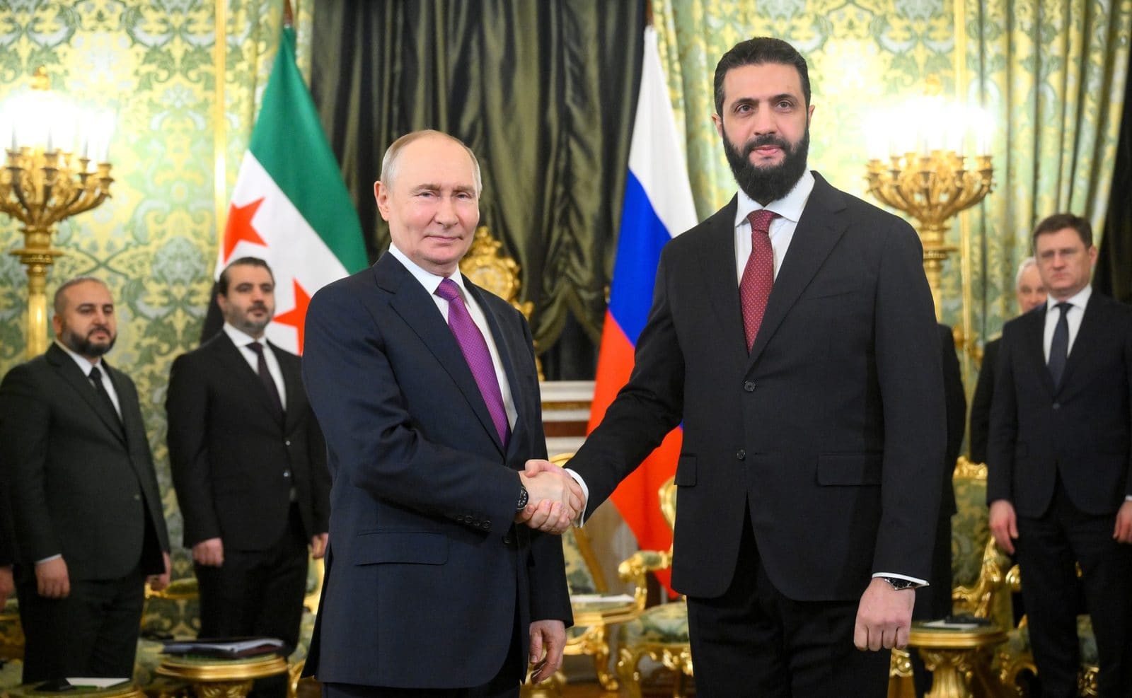 Russian President Vladimir Putin and Syrian President Ahmed al-Sharaa seated together at the Kremlin during a January 2026 meeting