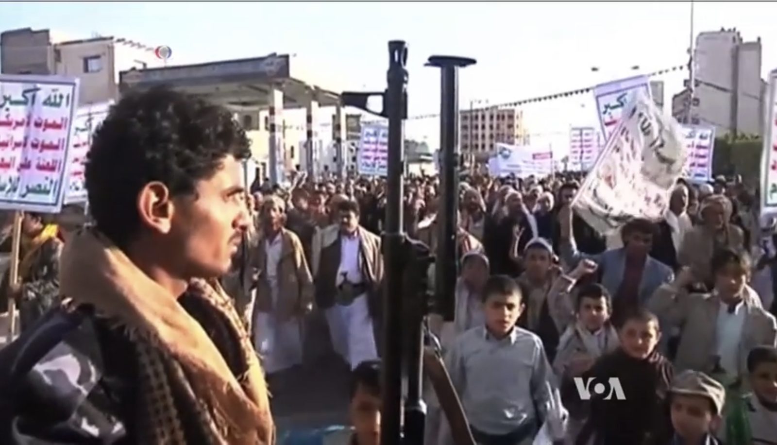 Houthi supporters demonstrate with movement flags in Sanaa, the capital seized by Houthi forces in September 2014