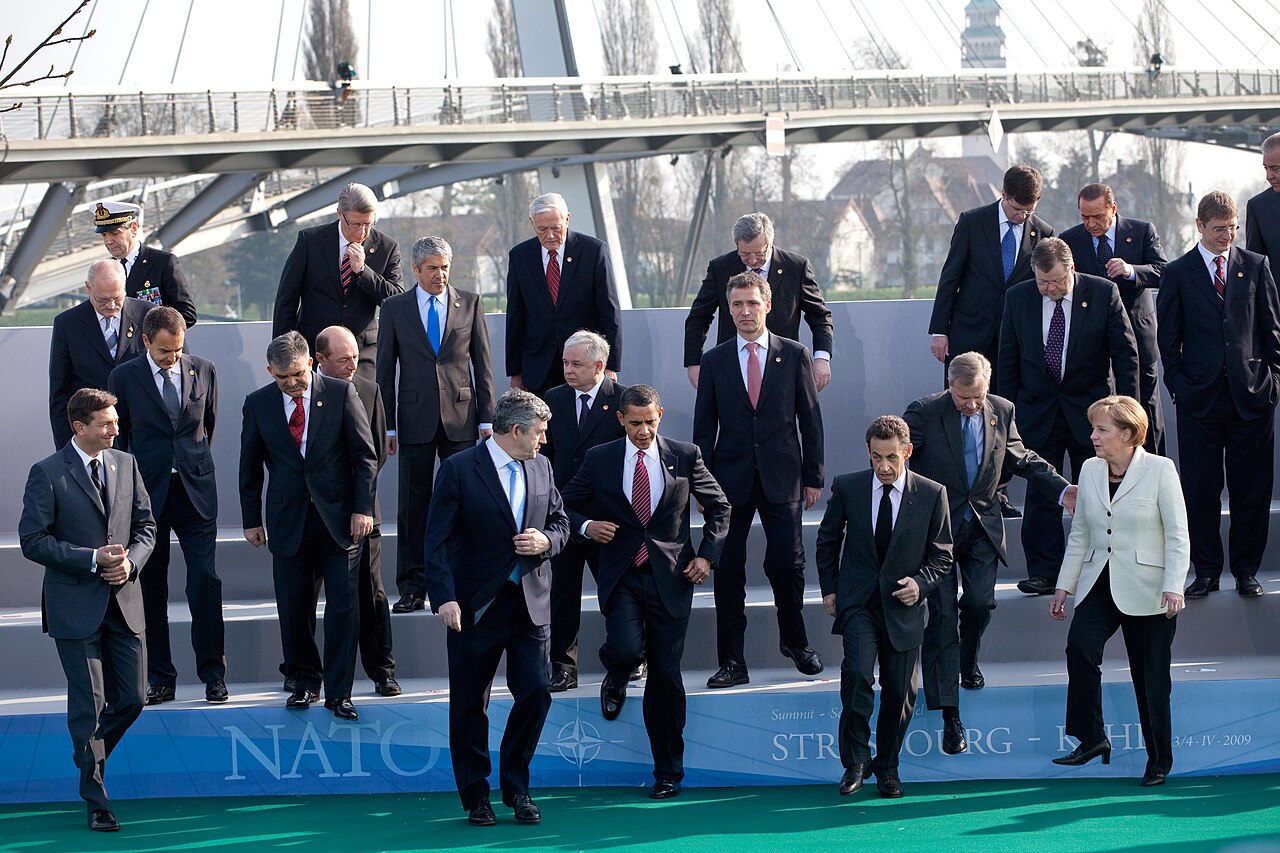 NATO heads of state and government pose for a group family photo at a NATO summit.