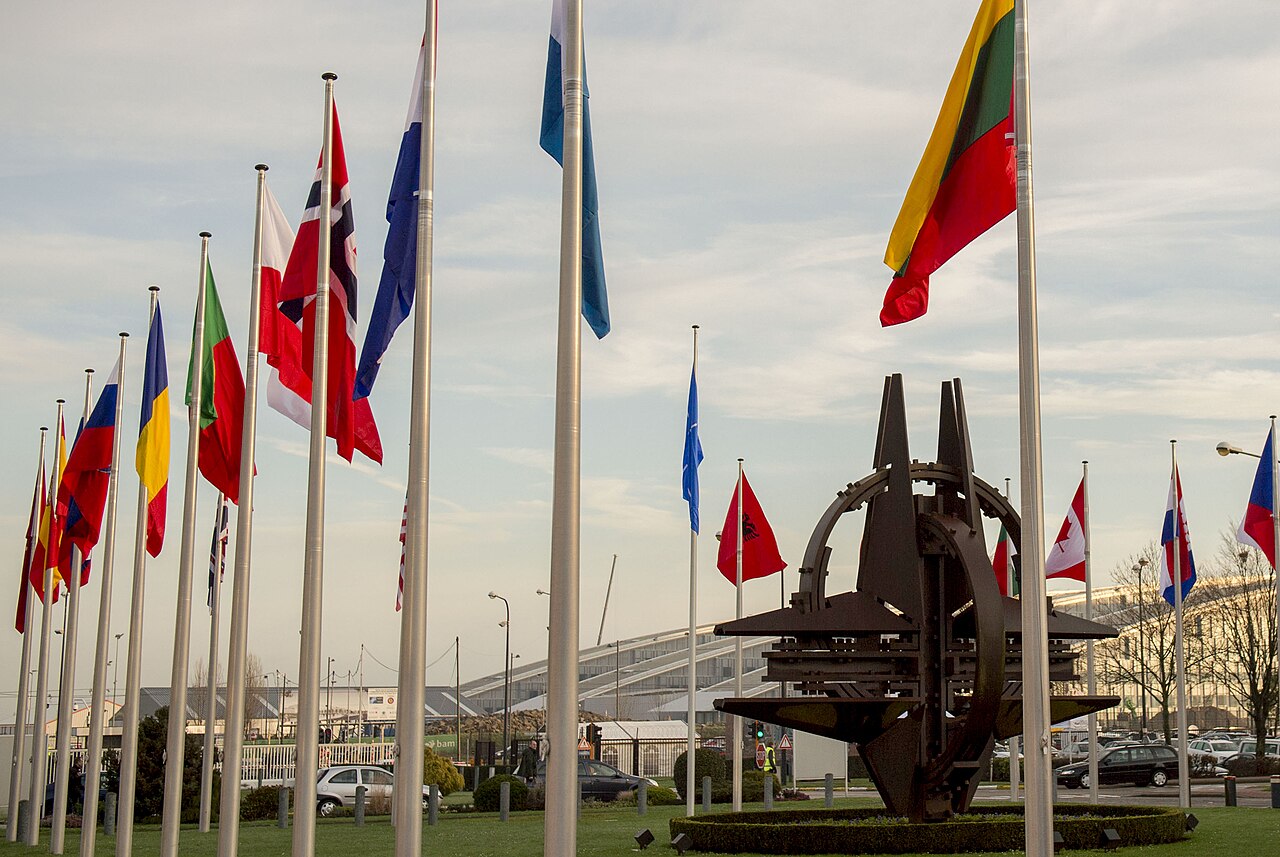 NATO member-country flags fly at the entrance to NATO headquarters in Brussels.